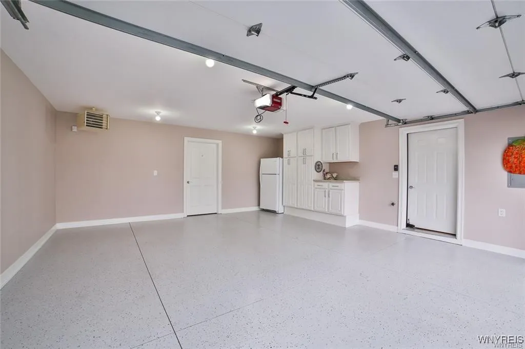 Spotless, Heated Garage,Epoxy Floor Painted Walls,Baseboard, Cabinetry, Refrigerator, Storage,Roomy Storage Closet