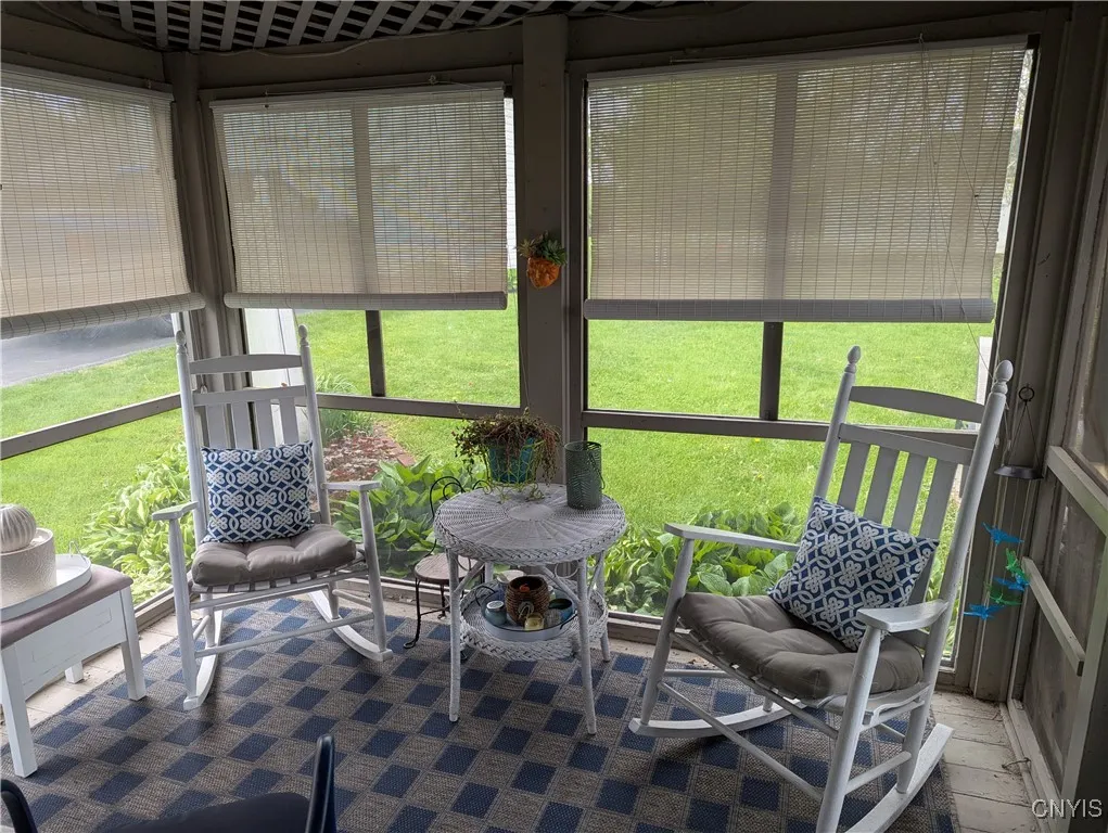 Screened in Porch what a great place to enjoy your morning coffee overlooking the back yard.