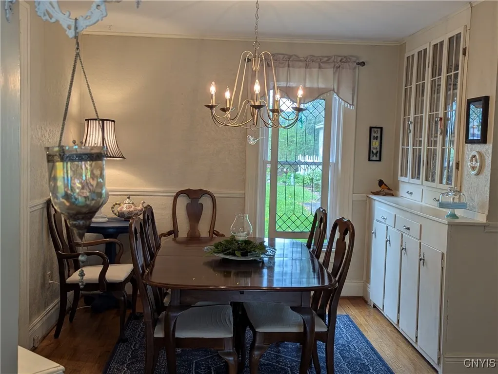 Formal dining room with chair rail, freshly painted in 2020 and a beautiful built-in wall hutch.