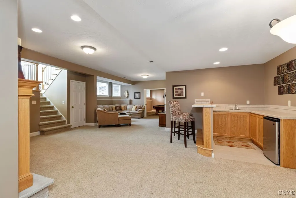 LOWER LEVEL FAMILY ROOM WITH AN ENTERTAINMENT BAR. PERFECT FOR SERVING FOOD OR DRINKS DURING LARGE GATHERINGS!!