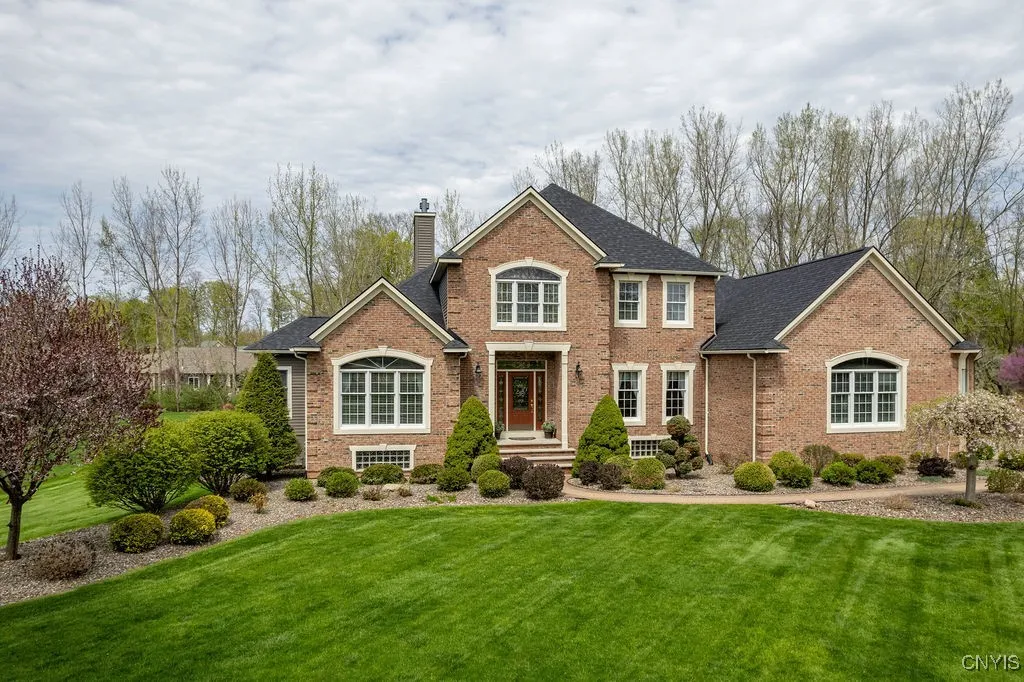FROM THE MOMENT YOU ARRIVE, THE HOME\'S BRICK FACADE, REVERSE GABLES, AND NEW HIP ROOF MAKE A LASTING IMPRESSION.