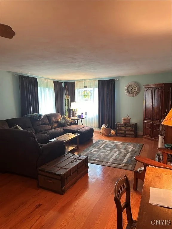 hardwoods, large living room will fit all of your big pieces!