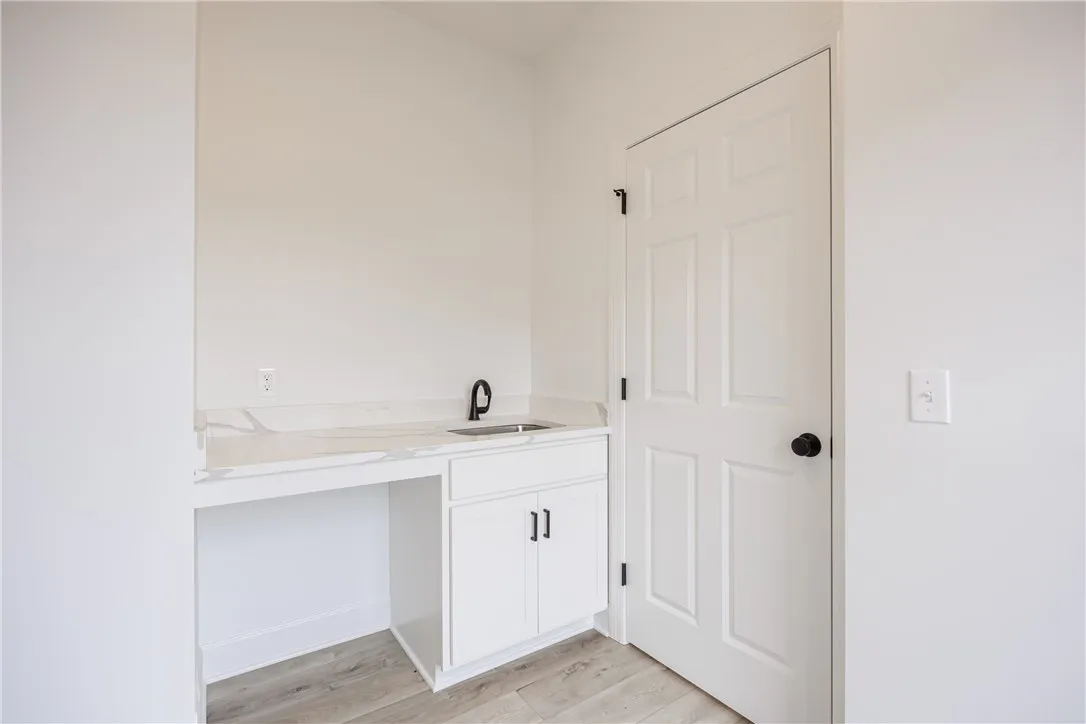1st Floor Laundry Room with sink and countertops