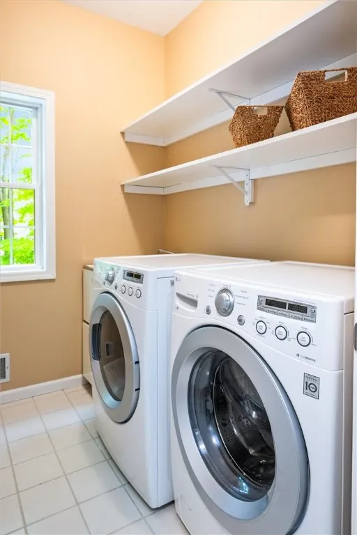 Fist floor laundry room next to pantry and exit to garage. Utility sink.