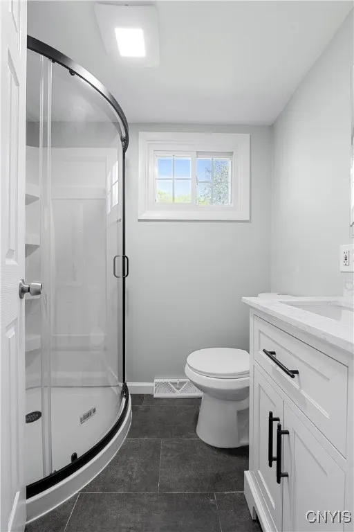 Half bath expanded and a stand up shower added for a second full bath