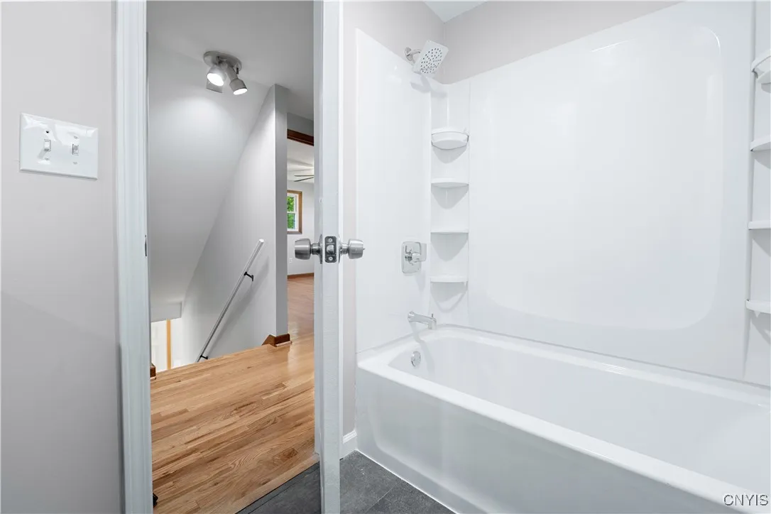 Brand new tub and surround including new fixtures