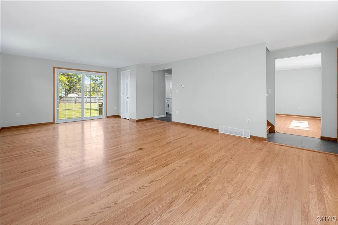 Large spacious living room with direct access to the back yard