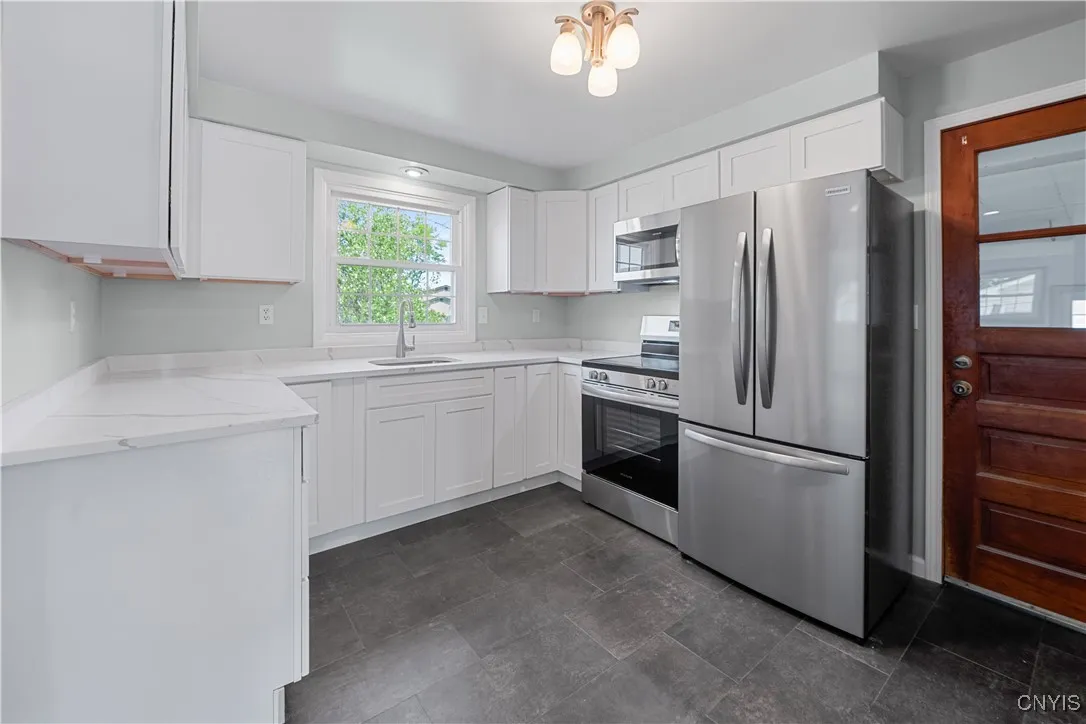 Fully remodeled kitchen with beautiful quartz countertops, slow closing cabinets and new appliances.
