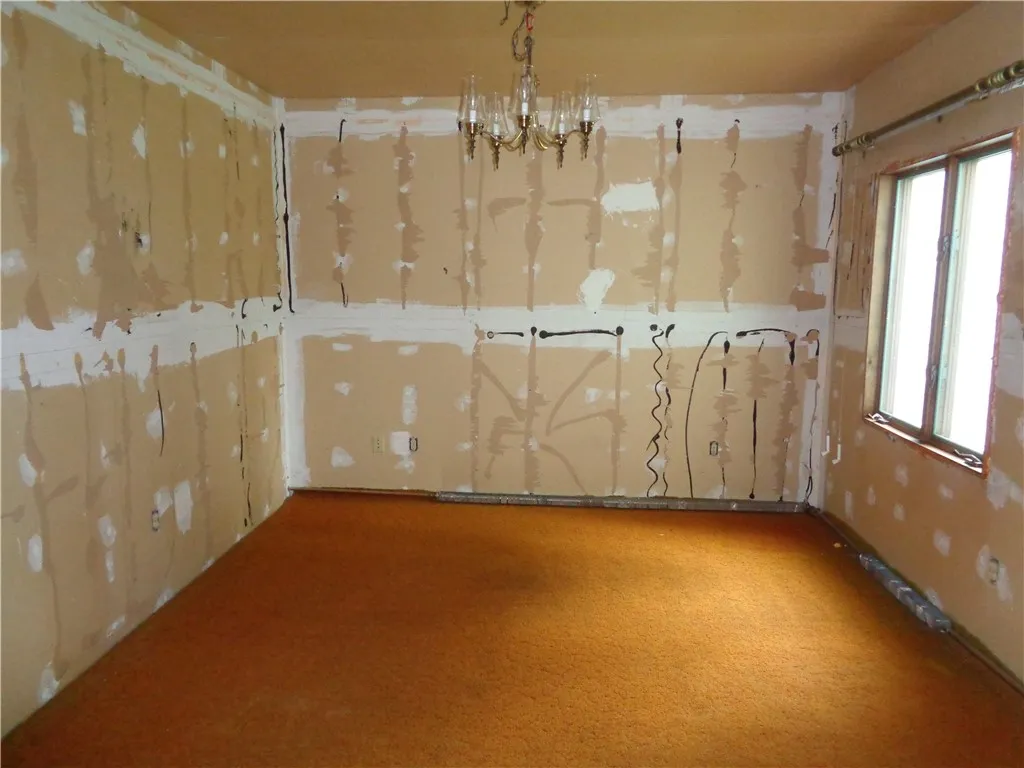 Dining Room - this room had the panelling removed and the drywall has been exposed.
