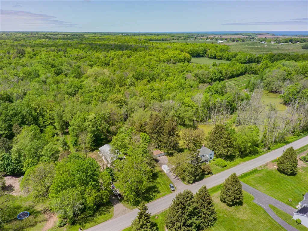 This home sits on over 13 acres - has a three bay garage too!