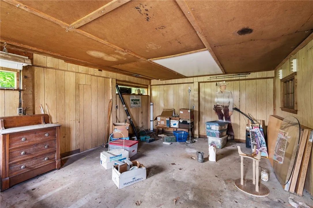 One of the THREE BAYS in the detached garage/workshop