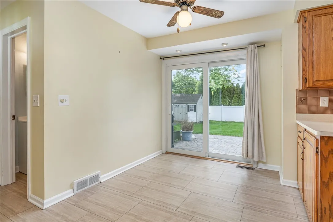 Eat-in dining with sliding doors to rear