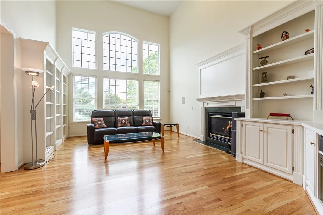 SPECTACULAR...... TWO STORY FIREPLACE GREAT ROOM WITH WALL OF WINDOWS & BEAUTIFUL HARDWOOD FLOORS!
