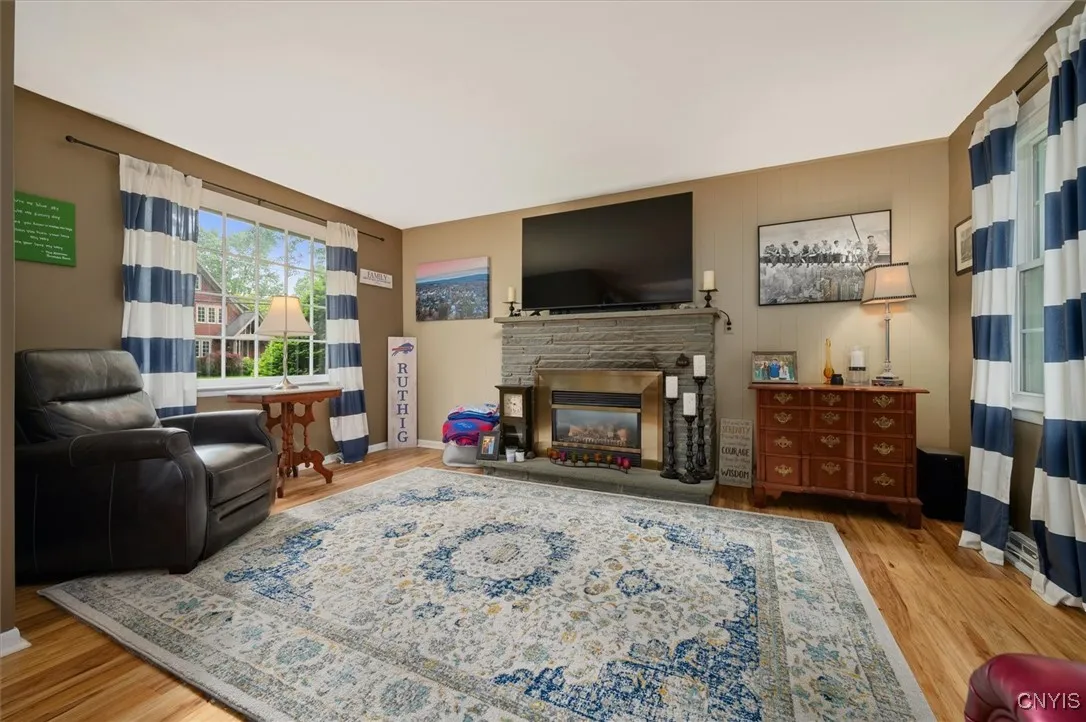 Cozy gas fireplace and well lit living space