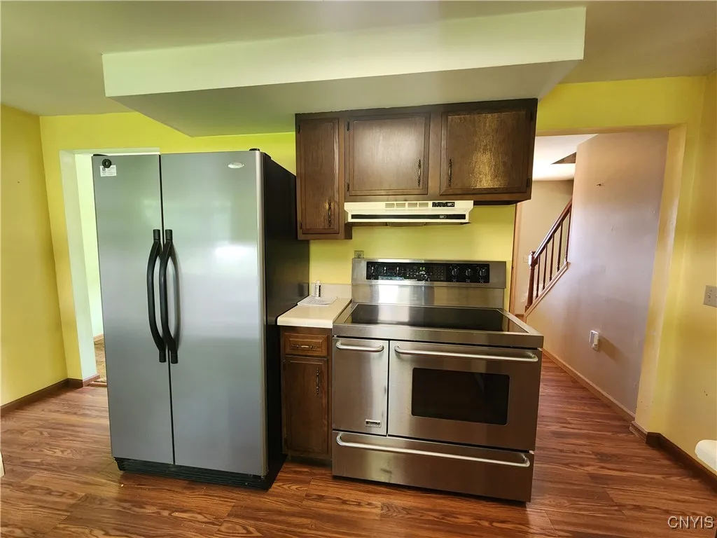 Pergo flooring extends throughout kitchen and laundry room