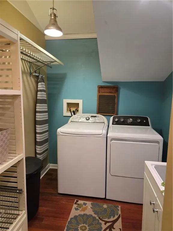 The first floor laundry is between the kitchen and the attached garage.