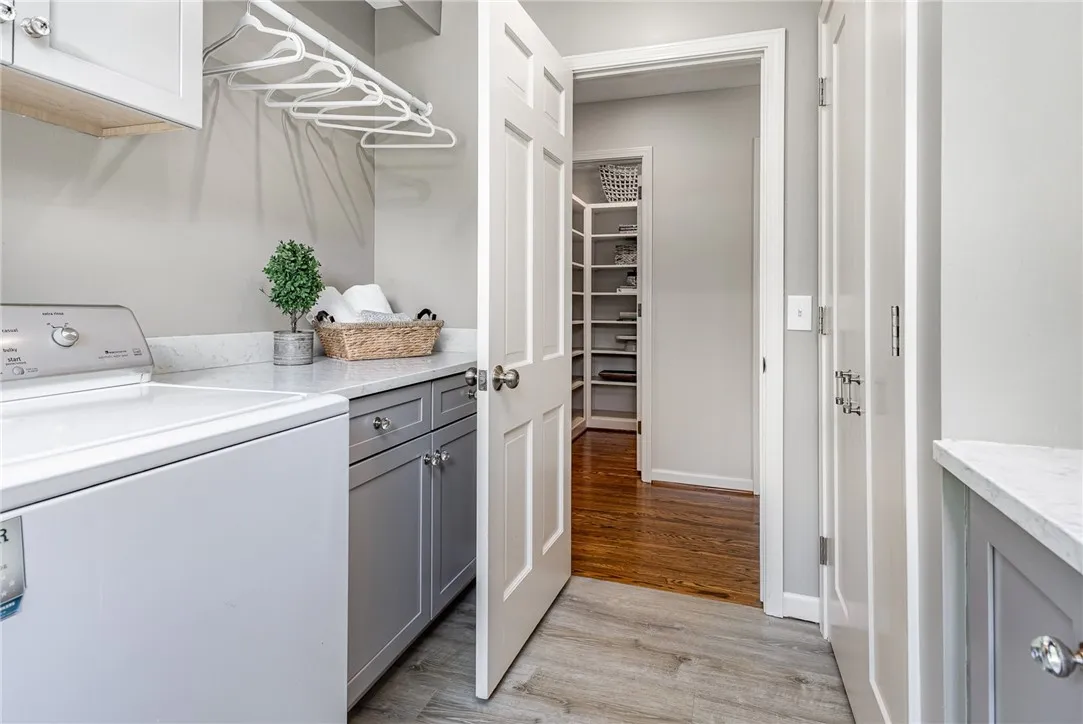 First floor laundry with sink and broom closet