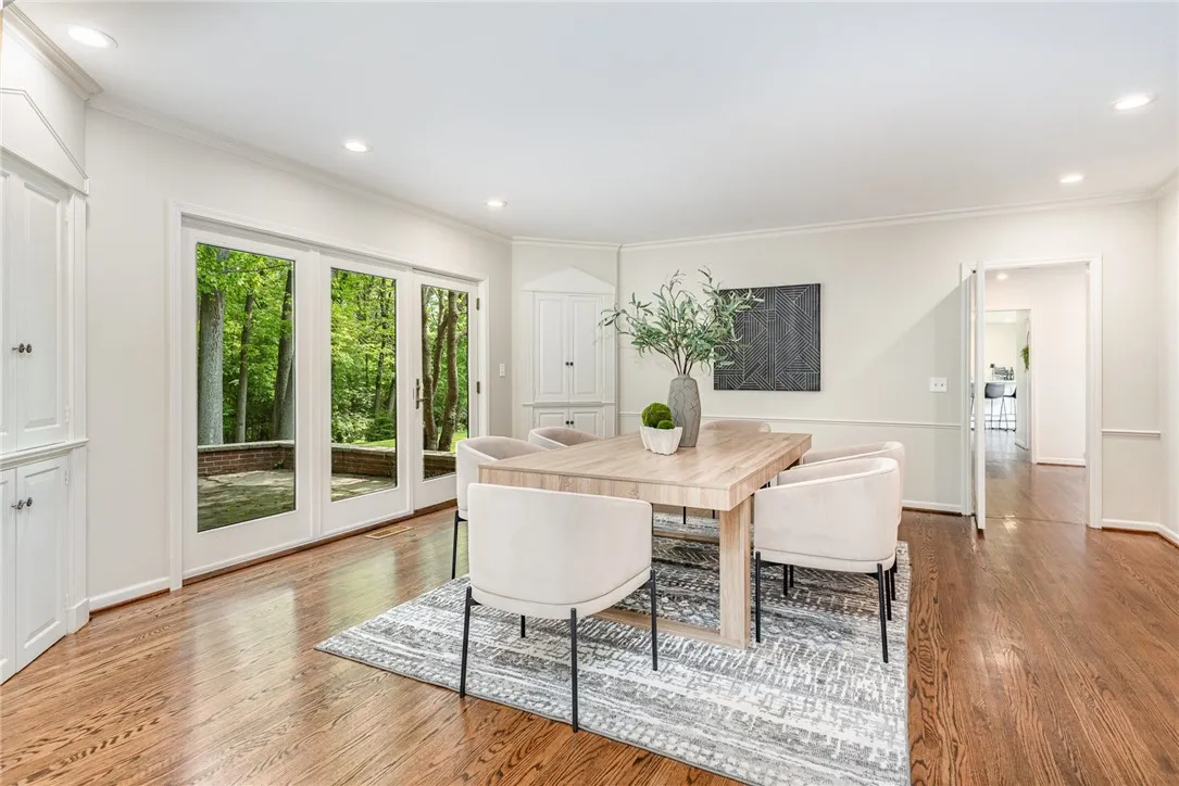 The large formal dining room has two corner built ins and atrium doors out to the back patio.