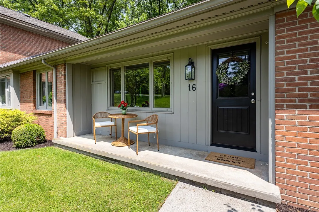 The side covered porch area has access to the mudroom