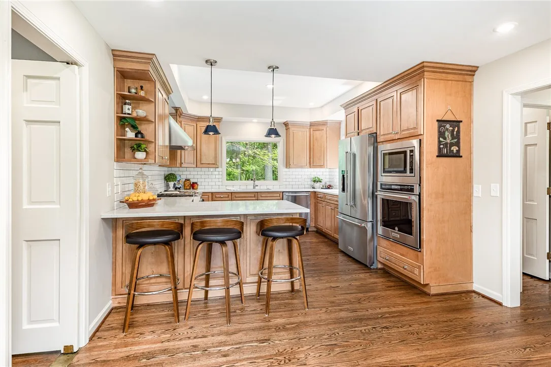The newer kitchen (renovated in 2022) has a breakfast bar and eat in area.
