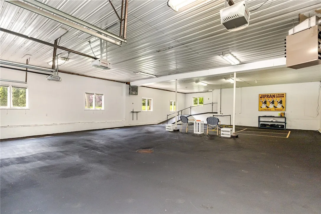This 1500 square foot heated garage space has room for 6 cars and plenty more space for your future workshop or car collection!