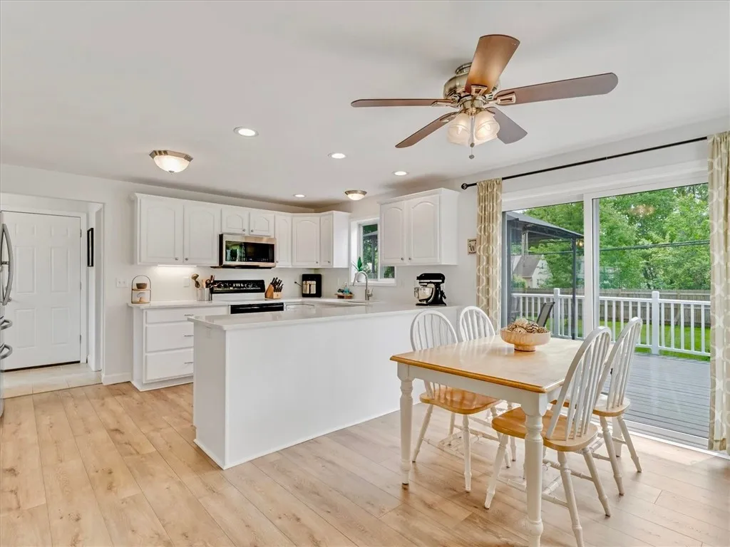 Updated kitchen with Quartz counters and brand new laminate floors. All appliances stay