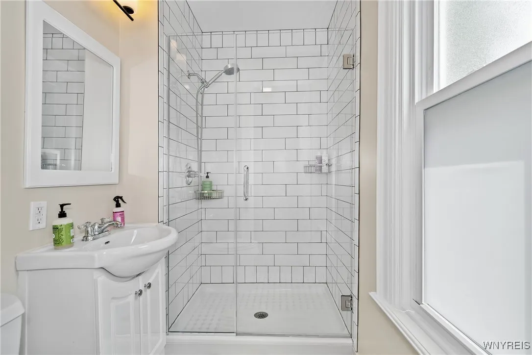 First floor apartment primary bedroom's ensuite bathroom