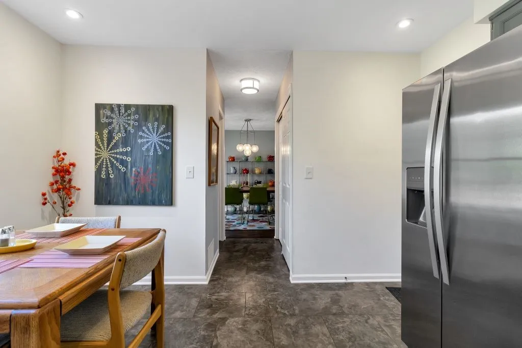 POWDER RM ON THE LEFT & PANTRY CLOSET ON THE RIGHT IN THE HALLWAY LEADING TO THE LIVING/DINING  AREA