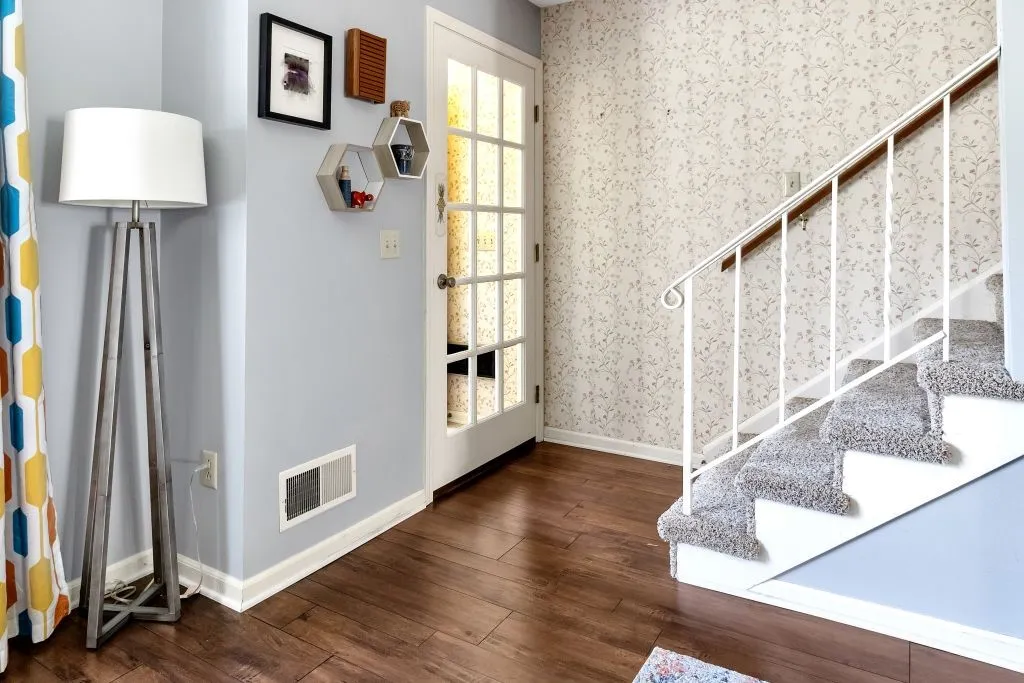 FRONT ENTRANCE DBL DOOR VESTIBULE W/ COAT CLOSET AND WALL HEATER