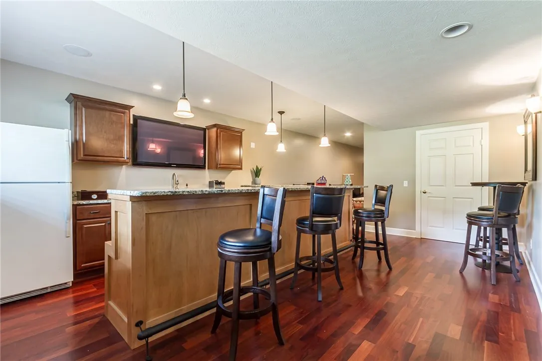 Wet bar with full-size fridge and dual wine fridge