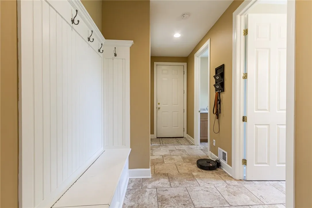 Hallway to garage, laundry 1/2 bath