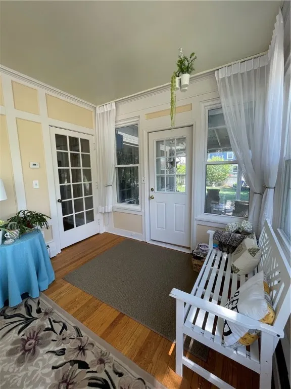 View of sunroom leading outside to covered patio.