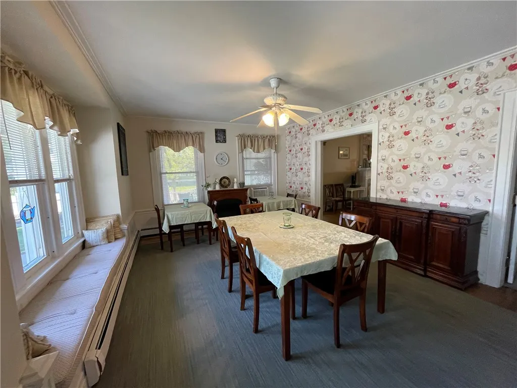 Dining room with large window seat.