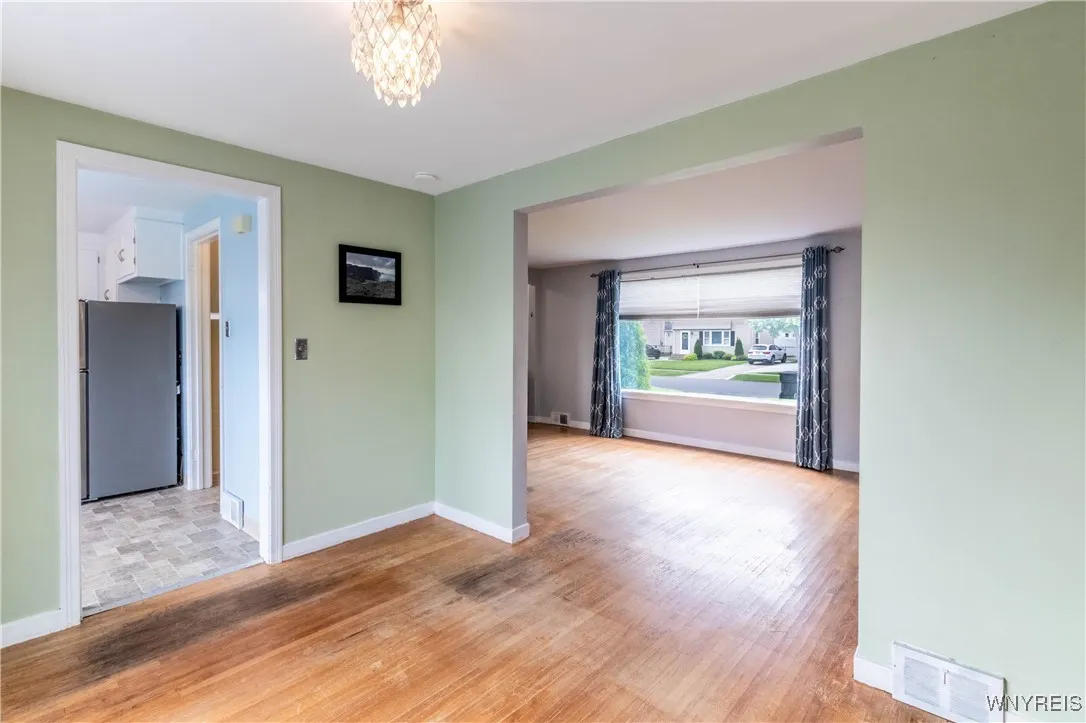 This is from the dining room - shows the flow from kitchen to dining room to family room - let the light in!