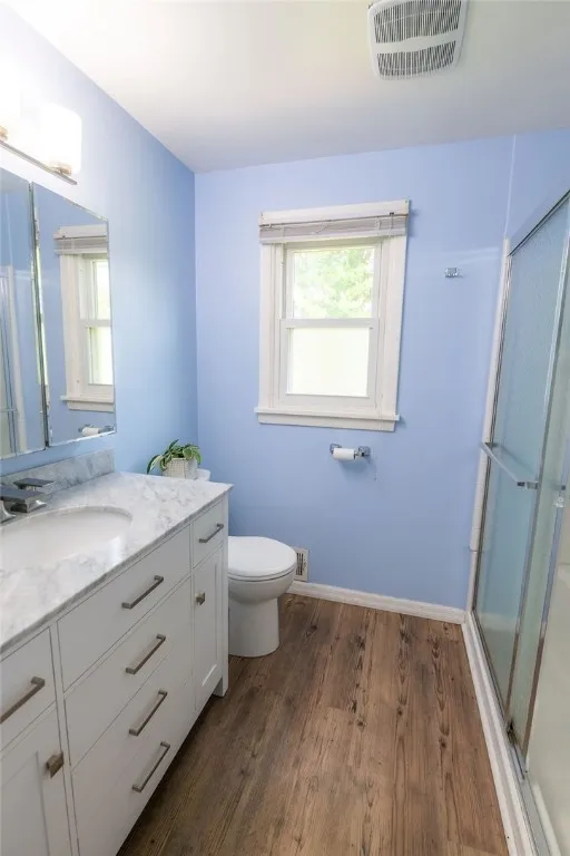 Main Bath with sliding glass door tub/shower combo, granite counter vanity, updated waterproof vinyl flooring and lots of flight