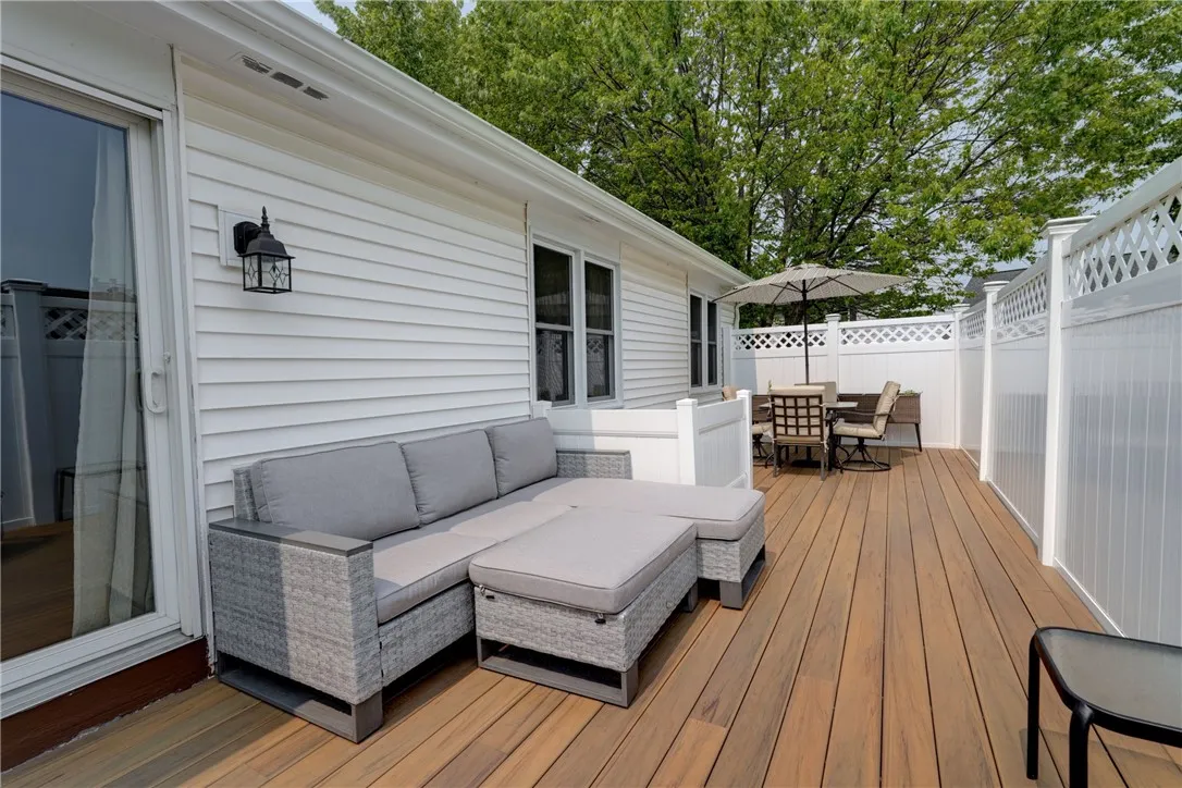 Private patio with trex style decking for low maintenance