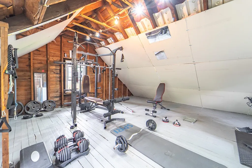 The walk-up attic flex space invites imagination—a yoga workout studio, art loft, or expanded storage.