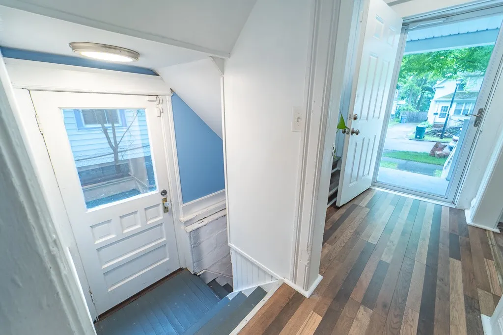 Conveniently located off the kitchen, the basement entrance leads to a full, spacious area complete with laundry facilities and versatile storage or workspace.