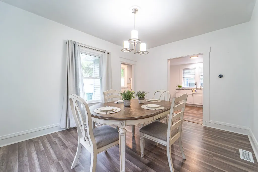 The dining room offers seamless flow to the kitchen and full bath, making it perfect for both everyday living and effortless entertaining.