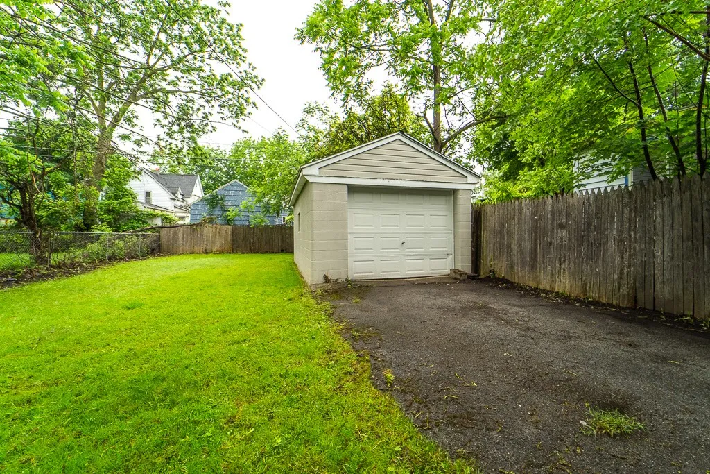 The detached garage comes equipped with an electric car charger an increasingly essential urban amenity.