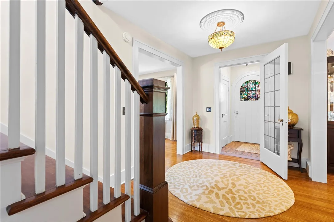 Gleaming hardwoods greet you as you come through the vestibule.