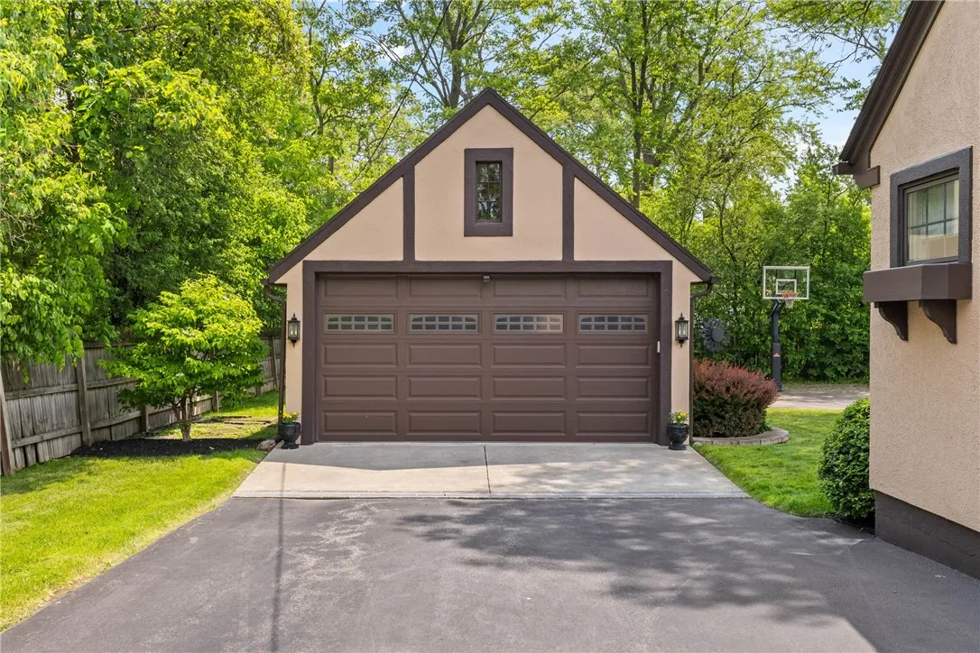 The 2 car garage includes a convenient EV charger and a dedicated storage area inside provides the perfect spot to keep pool gear, outdoor equipment, and seasonal essentials neatly organized.