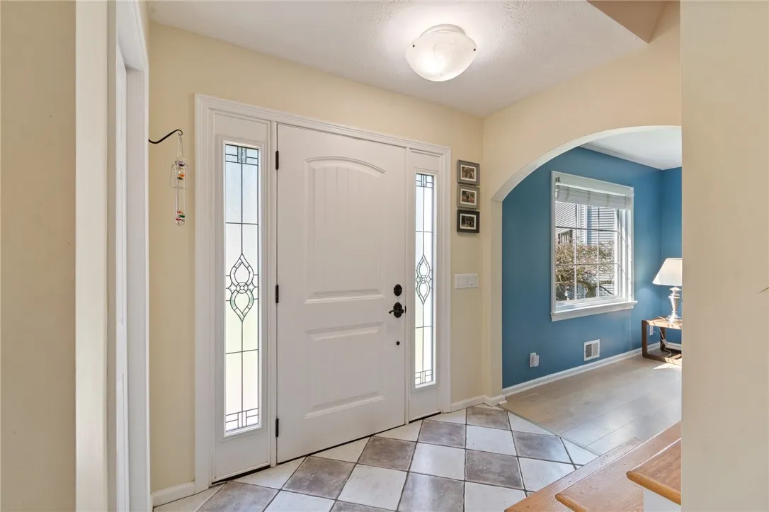 The entryway - the curved archways are such an elegant touch!