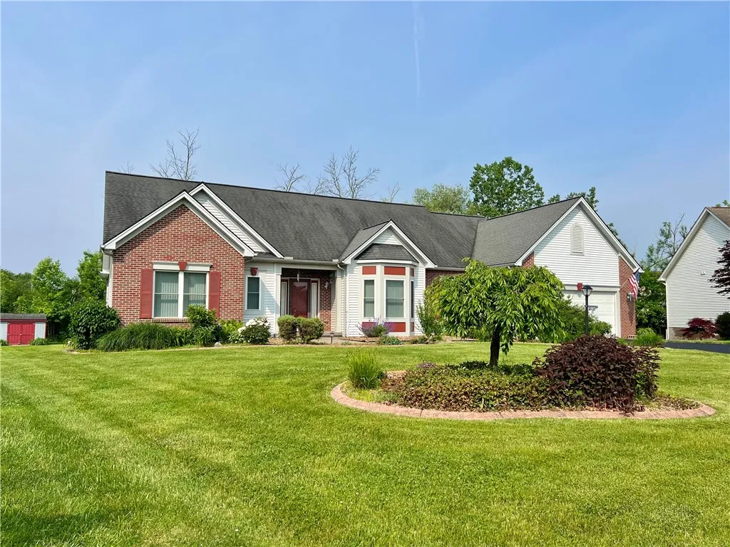 Exterior view w/shed and landscaping