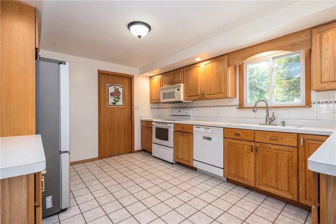 Neutral counters and oak cabinetry