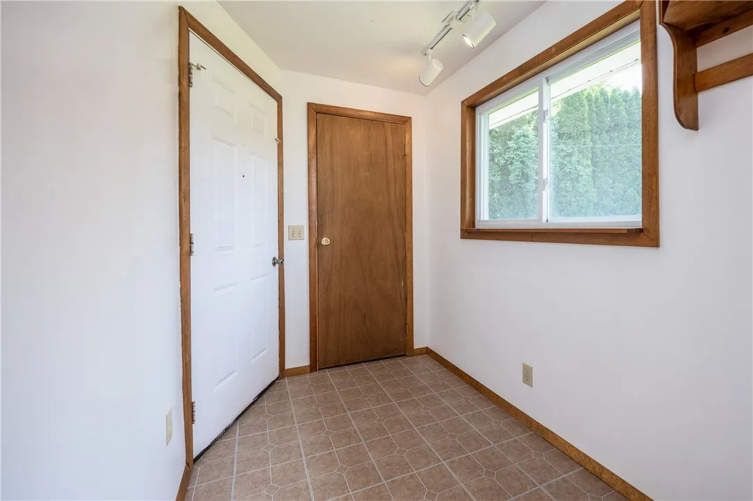 Mud room with closet and door to garage (could be laundry!!)