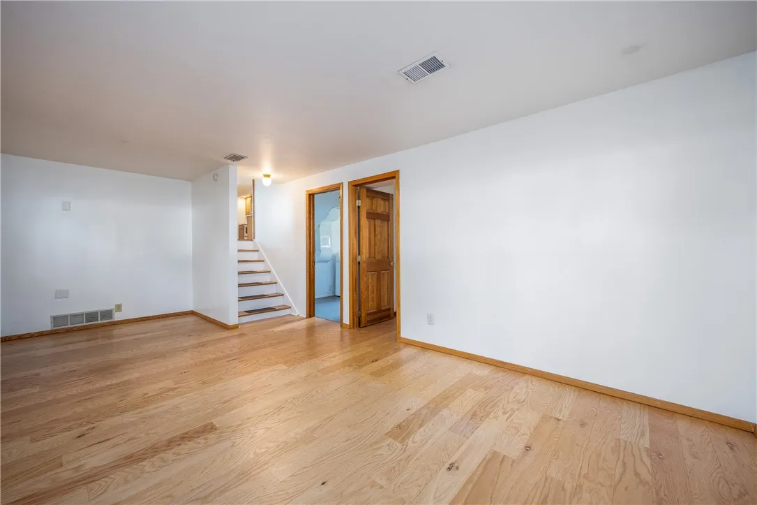 Family room features hardwood floors