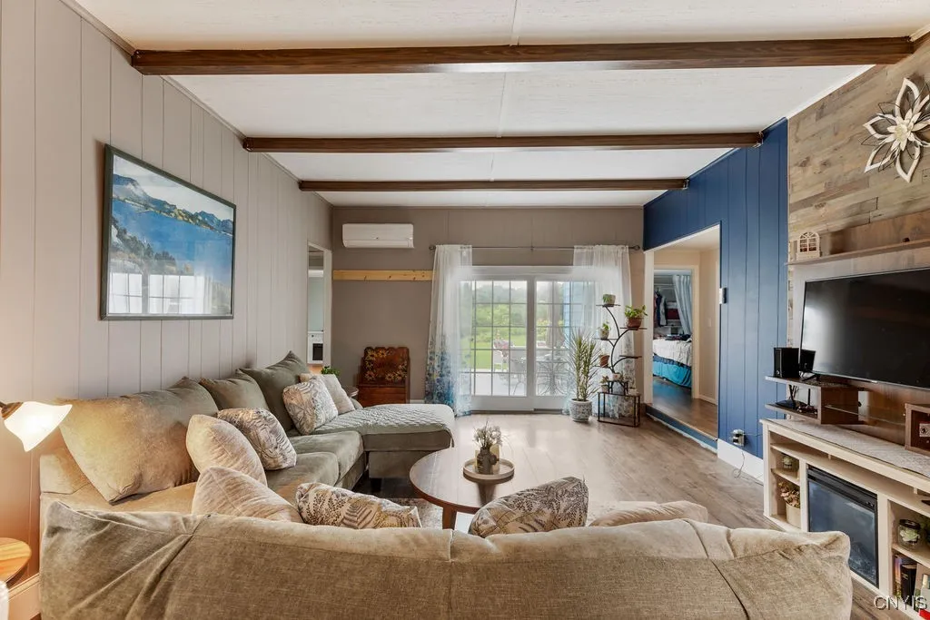 From the front entrance you can look right through the slider to the back yard. The room is full of natural light