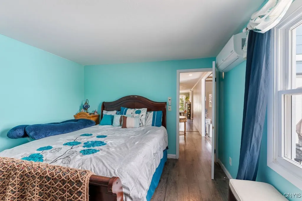 One one side of the home is this bedroom and a full bath