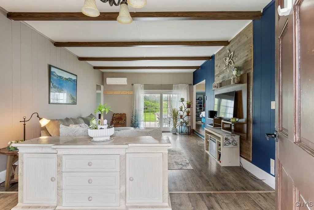 Enter the foyer and find a massive sunken living room.